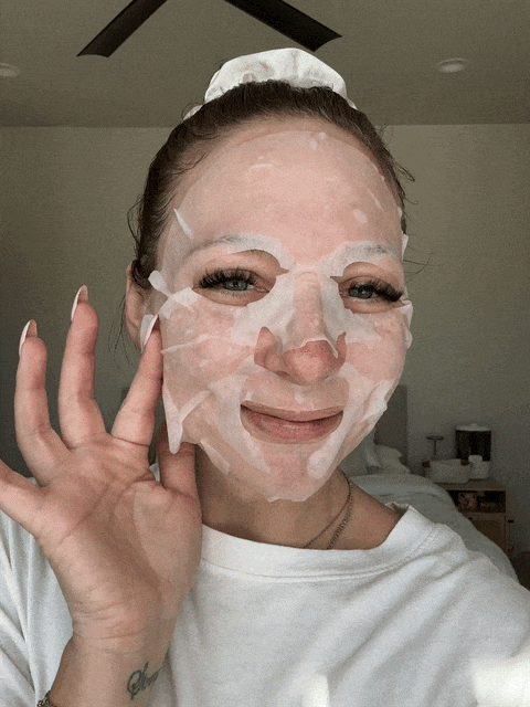 Woman showing off snail mask