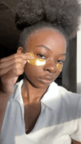 Woman removing eye mask