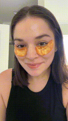 Woman applying eye mask
